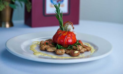 Herb Grilled Maine Lobster Tail on Arugula with Chive Ricotta Gnocchi & Corn Milk